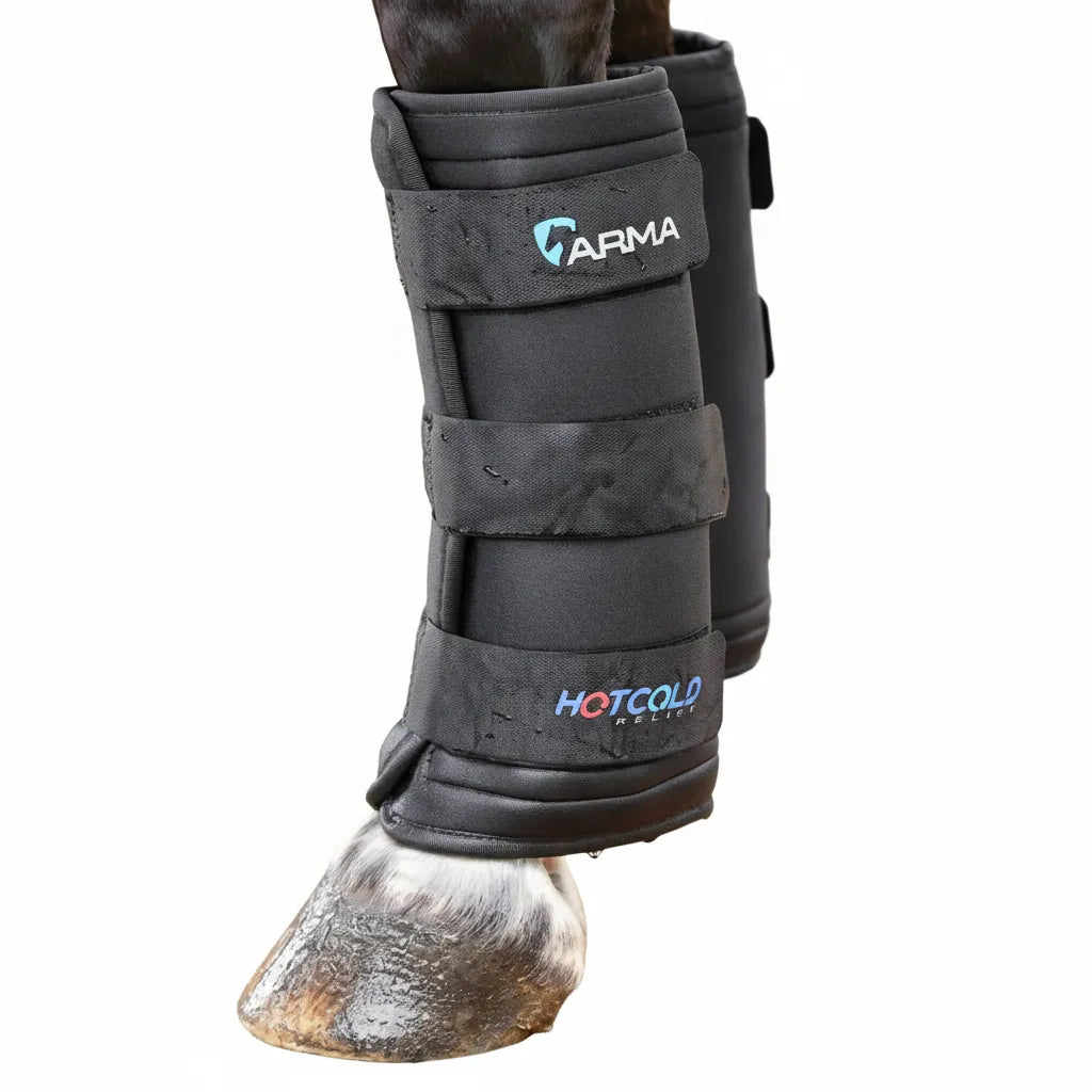 Shires ARMA Hot/Cold Relief Boots in black, designed for equine therapeutic compression and injury recovery. These durable leg wraps feature three secure straps and are shown on a horse's leg, highlighting moisture retention for effective cooling. Ideal for reducing inflammation and treating horse injuries, these cooling boots are a must-have for performance horse care, rehabilitation, and post-exercise recovery.