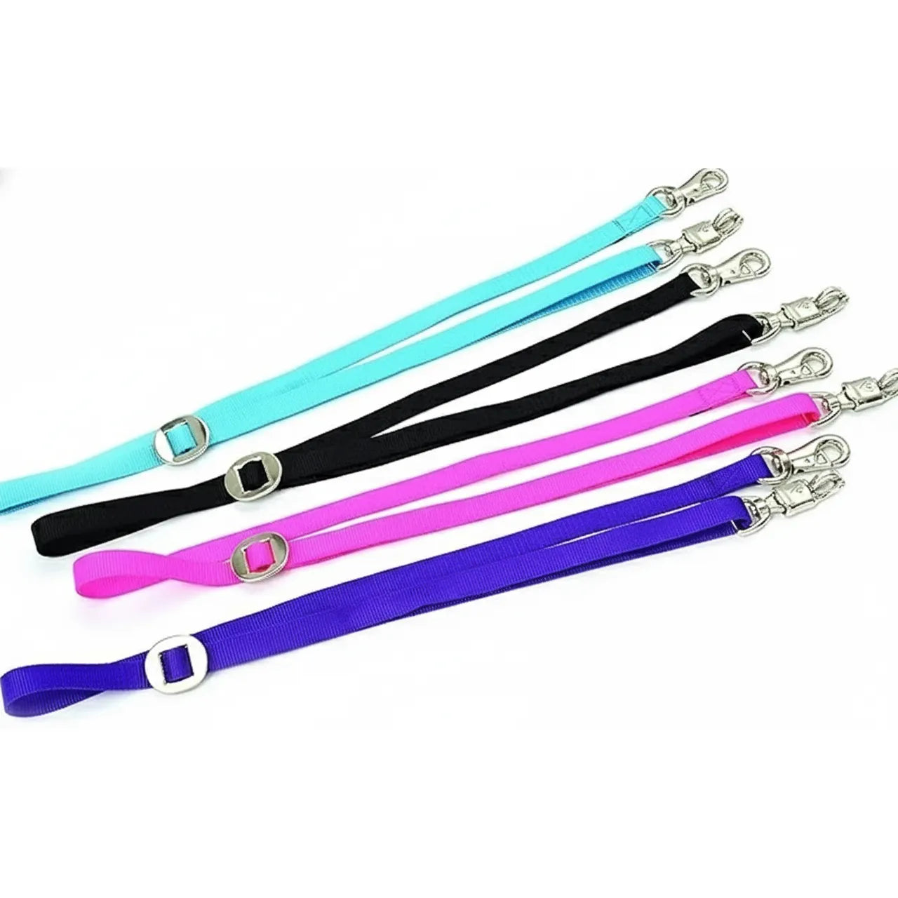 Shires Adjustable Woven Nylon Horse Cross Ties in vibrant teal, black, pink, and purple. This 68-inch equestrian stable essential features a quick-release emergency safety snap and a heavy-duty trigger hook. The durable nylon straps include a silver slider for custom length adjustment, making them perfect for safe horse grooming and cross-tying in the barn.
