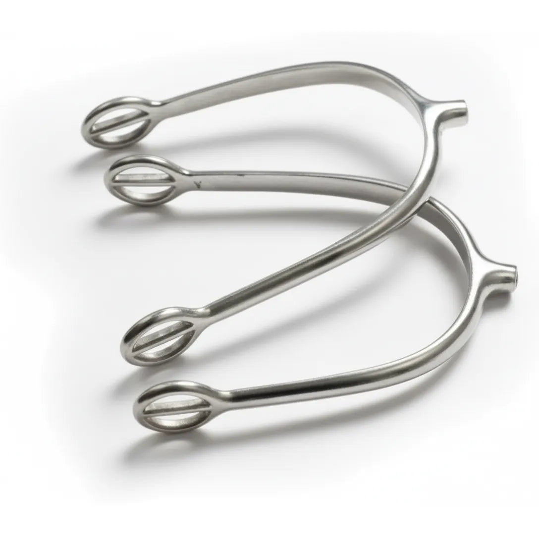 Shires Ladies Tom Thumb Spurs crafted from polished stainless steel. These gentle aid riding spurs feature a short 1/4" neck and slotted eyelets for secure spur strap attachment. Designed for English riders seeking subtle communication, these high-quality equestrian accessories offer a refined touch for dressage or jumping. Perfect for female horse riders who need a mild, effective training tool.