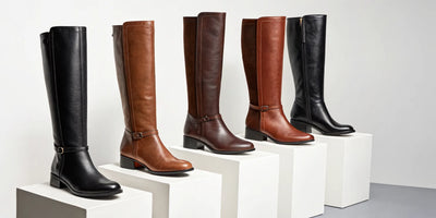 A variety of women's riding boots with heels in black and brown leather.