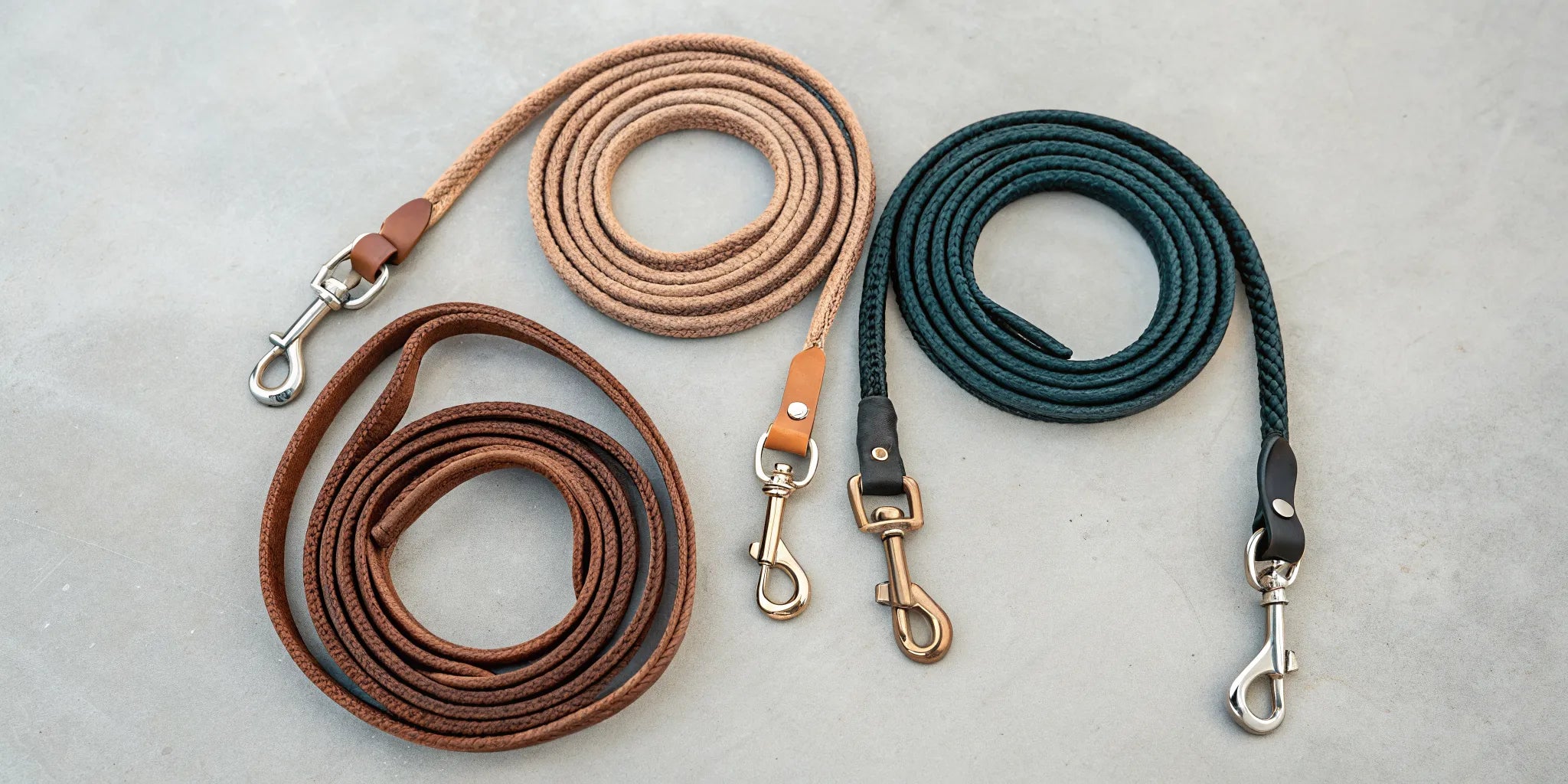 A selection of roping reins for horses showing various materials and styles.