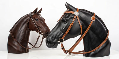 Two different leather Western headstalls on display to help a rider choose a style.