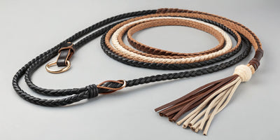 Mecate reins braided in black, brown, and tan with leather slobber straps and a popper.