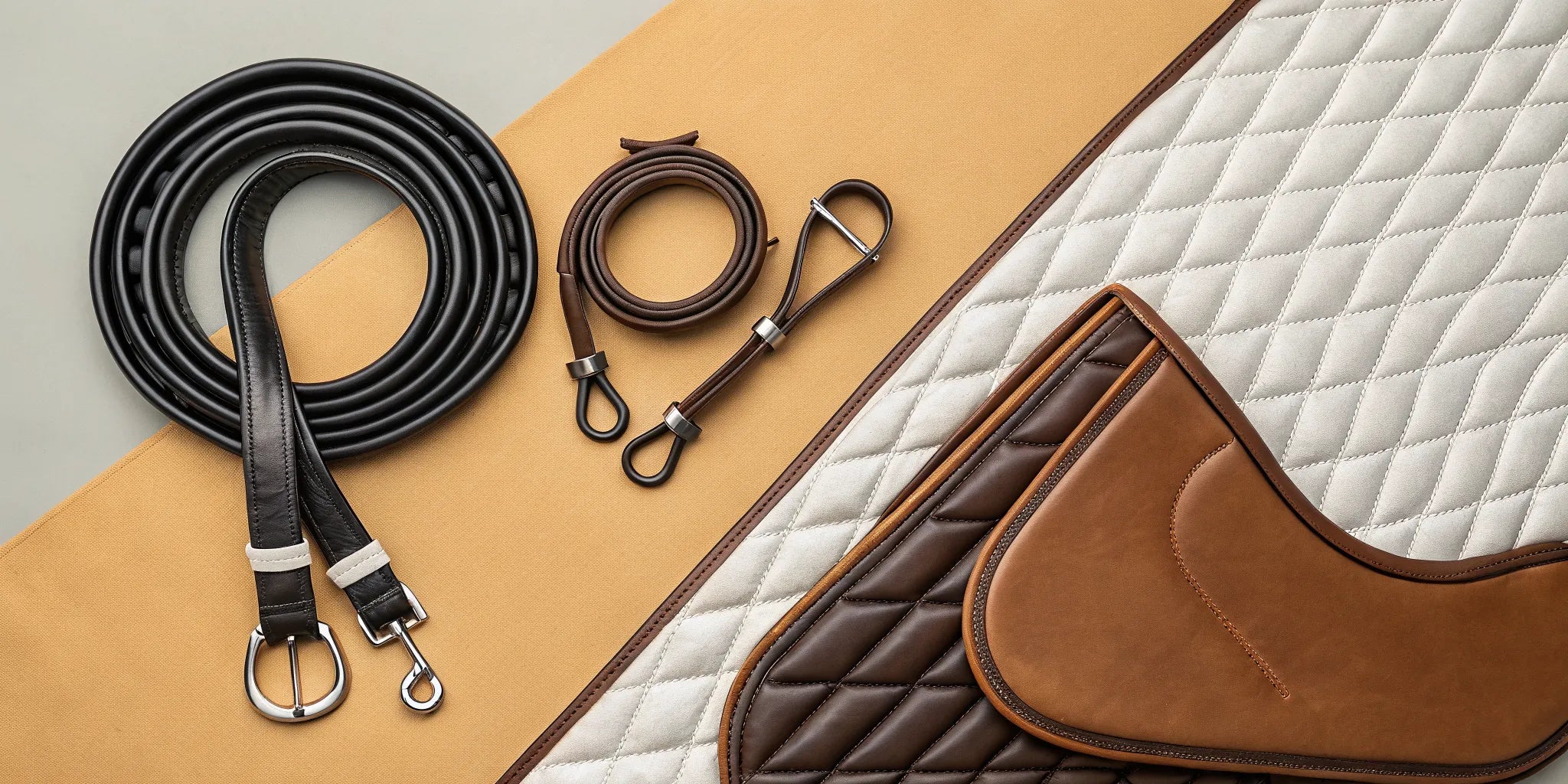 A collection of essential horse tack, including a saddle, bridle, and saddle pad.
