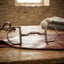 Lifestyle photo of Myler Medium Dee Low Port Comfort Snaffle Bit with Hooks MB 04 - 5 inch Sweet Iron with Copper Inlay