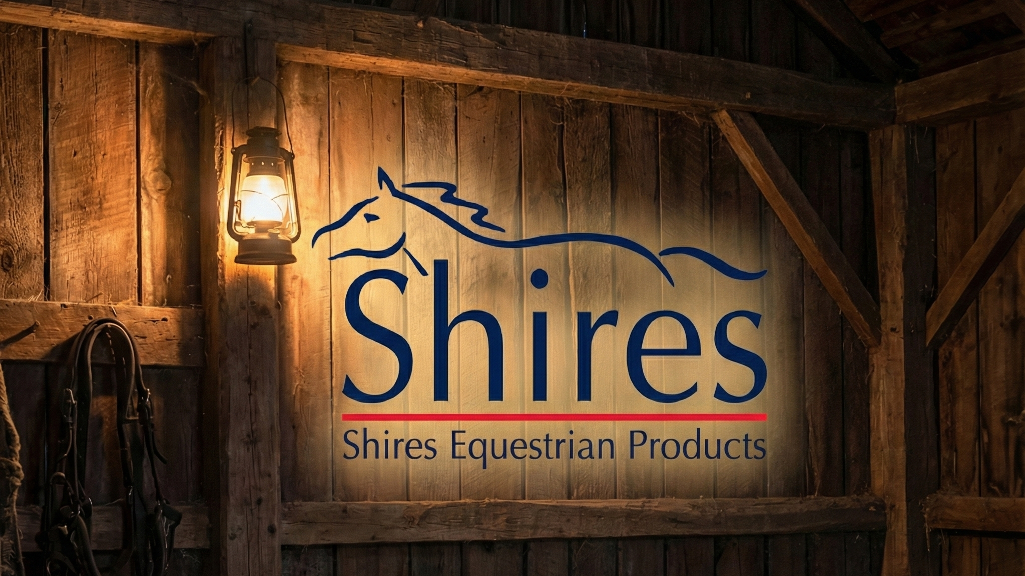 Shires Equestrian Products logo on a wooden wall in a barn setting.