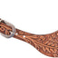 Brown leather spur with intricate designs on a white background