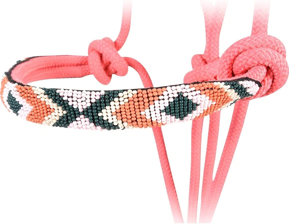 Beaded hair tie with pink cord on a white background