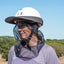 Cashel Quiet Ride Fly Mask for horse riders, featuring a black fine-mesh veil that shields the face and neck from biting insects and flies. Shown attached to a white equestrian helmet with a wide sun brim, this lightweight mesh protector provides clear visibility and breathable fly protection. A must-have equestrian accessory for comfortable, bug-free trail riding and insect protection during summer rides.