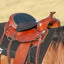 Cashel Western Tush Cushion Foam in black, designed for ultimate comfort on a brown leather Western saddle. This orthopedic foam seat pad reduces fatigue during long trail rides or ranch work. Securely fits the saddle seat to provide shock absorption and pressure relief for riders. Essential equestrian accessory for Western riding comfort and endurance.