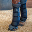 Classic Equine Ceramic Blue Therapy Wraps on a horse’s legs, designed to reduce inflammation and aid recovery. These black equestrian support boots feature a ceramic-infused grey liner to increase blood flow and multiple secure Velcro straps. Ideal for equine rehabilitation and post-workout cooling, these therapeutic leg wraps provide essential support and healing for performance horses in the stable.