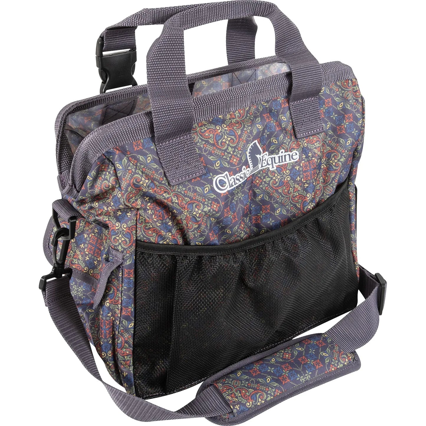 Classic Equine Groom Tote in a vibrant spice paisley print featuring intricate blue, red, and gold patterns. This durable equestrian gear bag includes a large mesh exterior pocket for ventilation, sturdy grey top handles, and an adjustable, padded shoulder strap with buckle clips. Perfect for organizing horse grooming brushes and supplies at the stable or horse shows. Features the signature Classic Equine logo on the front. A stylish and functional must-have for every rider.