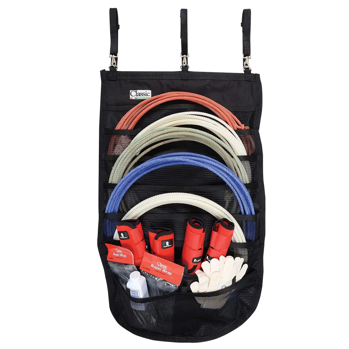 Classic Equine Hanging Rope Organizer for organized tack room storage. This black mesh hanging bag features pockets for up to 18 ropes, shown holding coiled red, cream, and blue lariats. Three adjustable straps with silver clips allow for easy hanging in horse trailers or barns. The bottom mesh pockets provide extra storage for red horse boots, white riding gloves, and roper wrap accessories. An essential space-saving solution for western riders and ranch gear organization.