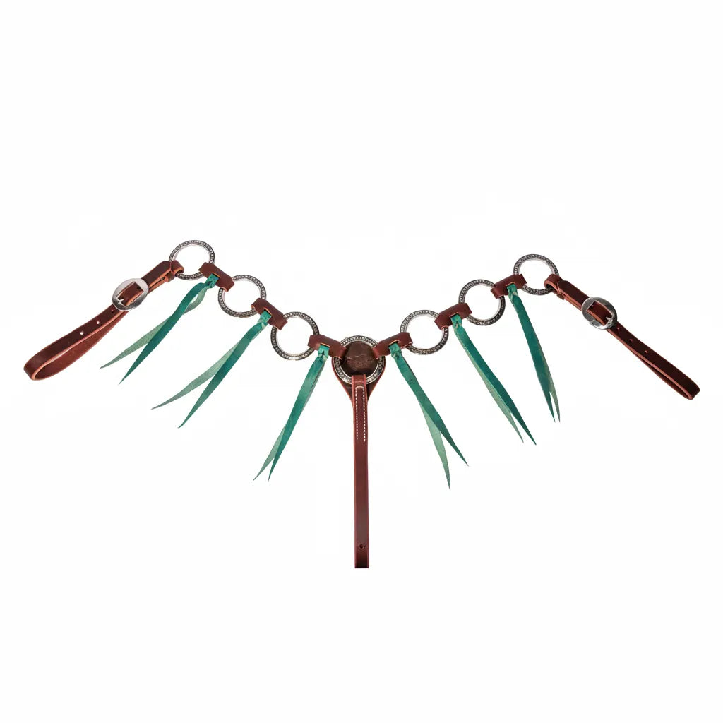 Professional's Choice Pony Ring Breast Collar in burgundy latigo leather with vibrant emerald tassels. This pony-sized western breast collar features multiple decorative silver-etched rings and adjustable straps with classic buckles. The striking emerald green leather tassels hang from each ring, offering a stylish look for horse shows, barrel racing, or trail riding. High-quality pony tack designed for both durability and eye-catching western flair.