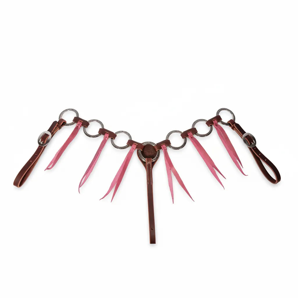 Professional's Choice Pony Ring & Tassel Breast Collar in rich brown leather featuring vibrant orchid pink tassels. This western pony horse tack showcases ornate silver decorative rings and a central concho. Includes 3/4-inch adjustable leather tugs with silver buckles. Perfect for adding a pop of color to your pony’s performance or trail gear. Durable and stylish equestrian equipment designed for a secure fit on small horses and ponies.