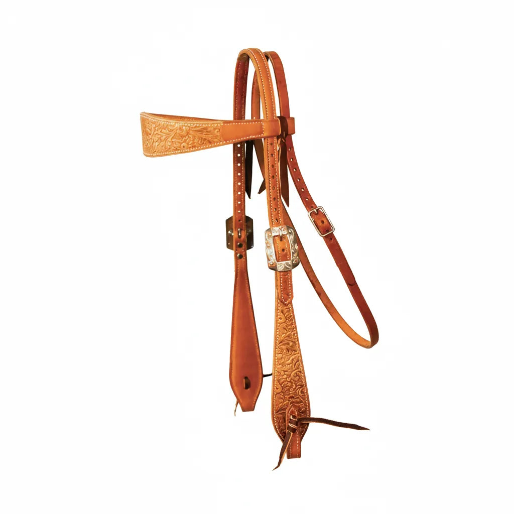 Professional's Choice Floral Tooled Browband Headstall in rich chestnut leather. This Western horse headstall features intricate hand-tooled floral patterns on the browband and tapered cheekpieces. Accented with striking white contrast stitching and an ornate engraved silver buckle, this durable and stylish tack is perfect for horse shows, performance events, or everyday riding. High-quality craftsmanship for a classic Western look.