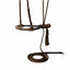 Professional's Choice Premium Braided Leather Training Rawhide Bosal in Black/Chocolate. Features a hand-braided rawhide noseband, dark chocolate leather headstall with silver buckle, and a coordinating brown braided rope mecate with a horsehair tassel. This professional-grade hackamore setup is ideal for western horse training, offering durability and refined control for riders and trainers seeking high-quality equestrian tack.