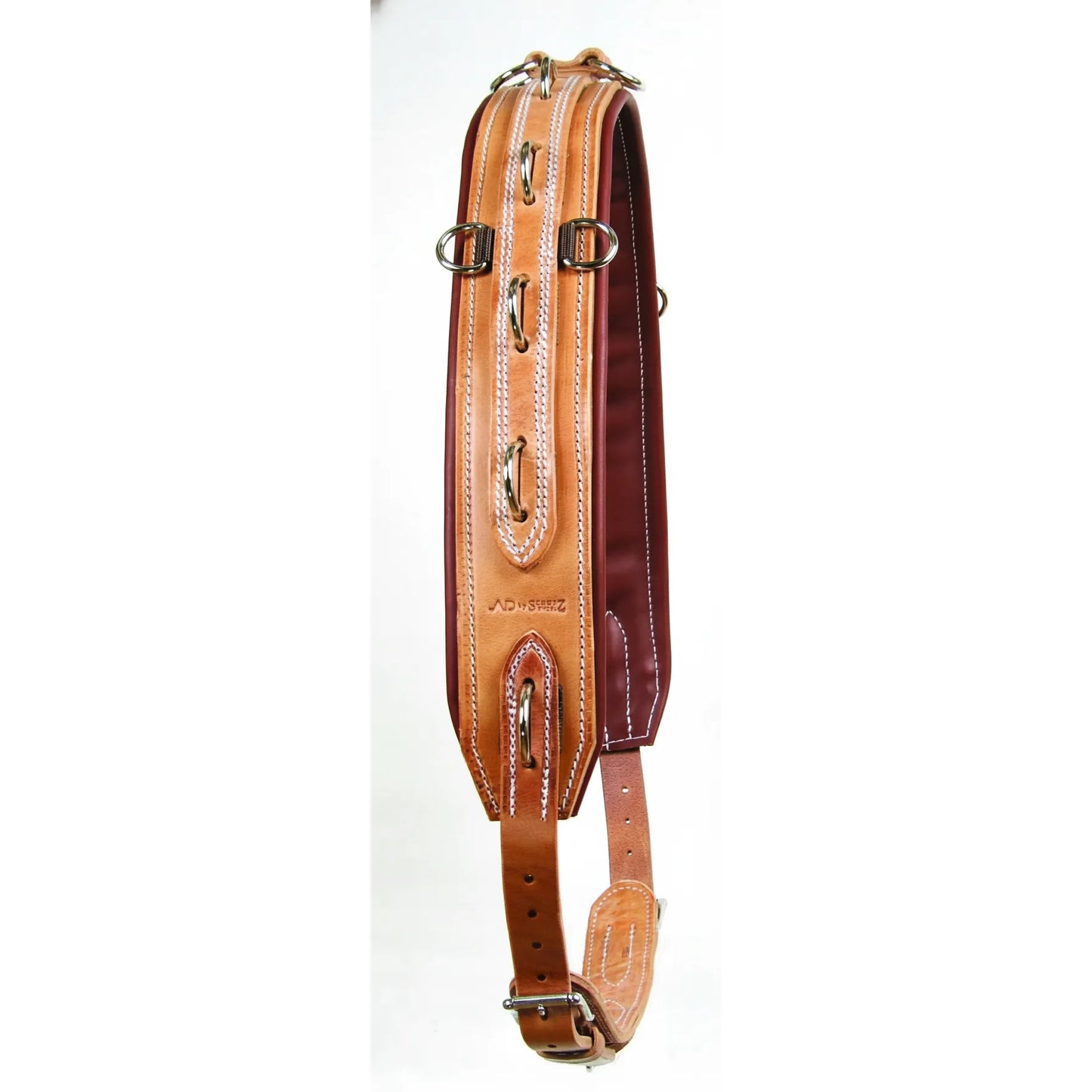 Professional's Choice Al Dunning Pro-Training Surcingle crafted from premium Hermann Oak leather. This high-quality equestrian training tool features multiple metal rings for versatile attachment points, elegant white contrast stitching, and a padded dark brown underside for horse comfort. Adjustable from 61 to 77 inches, it’s a must-have for ground driving and lunging. Durable, professional-grade leather horse gear for serious trainers.