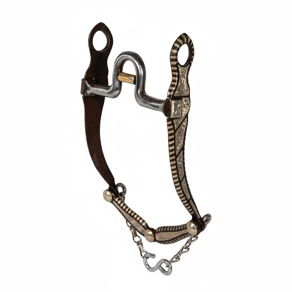 Professional's Choice Bob Avila California Cow Horse Bit featuring a 5" sweet iron mouth with a copper roller and 8" curved shanks. The bit showcases beautiful silver floral engraving and striped detailing on dark browned steel. Ideal for western performance and cow horse disciplines, this high-quality horse bit combines expert craftsmanship with classic style for effective communication and a stunning look in the show ring.