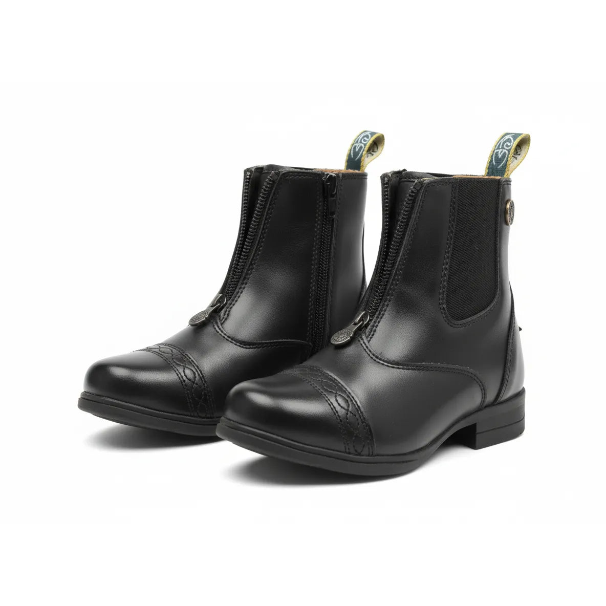 Shires Moretta Clio Plus child’s paddock boots in black leather, featuring a front-zip closure and decorative punched-toe cap detail. These durable equestrian riding boots include elastic side panels and branded pull tabs for easy on-and-off. Ideal for young riders, these stylish boots offer a classic look for horse riding lessons and shows.
