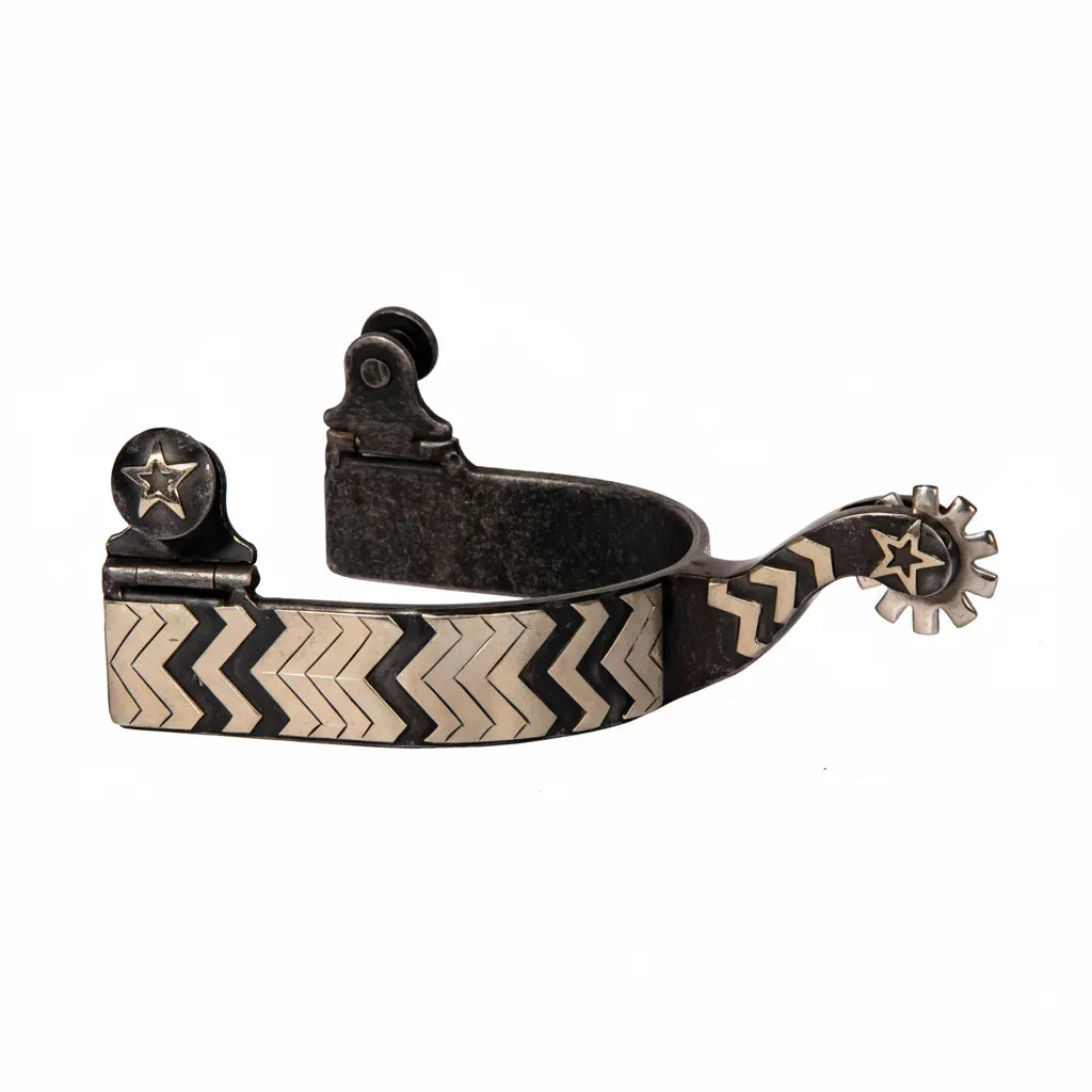 Professional's Choice Copper Canyon Western Riding Spurs featuring a dark antique finish and elegant silver chevron zig-zag inlay. These performance equestrian spurs offer a 1" band, 1" shank, and a 10-point star rowel for precise cues. Finished with decorative star accents on the buttons and shank, this high-quality western horse riding equipment combines style and function for any rider.