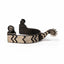 Professional's Choice Copper Canyon Western Spurs with a 3/4" dark steel band adorned with intricate copper chevron overlays. These high-quality equestrian spurs feature a 10-point rowel and decorative copper stars on the neck and swivel buttons. Durable and stylish western horse riding gear, perfect for cowgirls and cowboys looking for premium tack with a classic Southwestern flair.