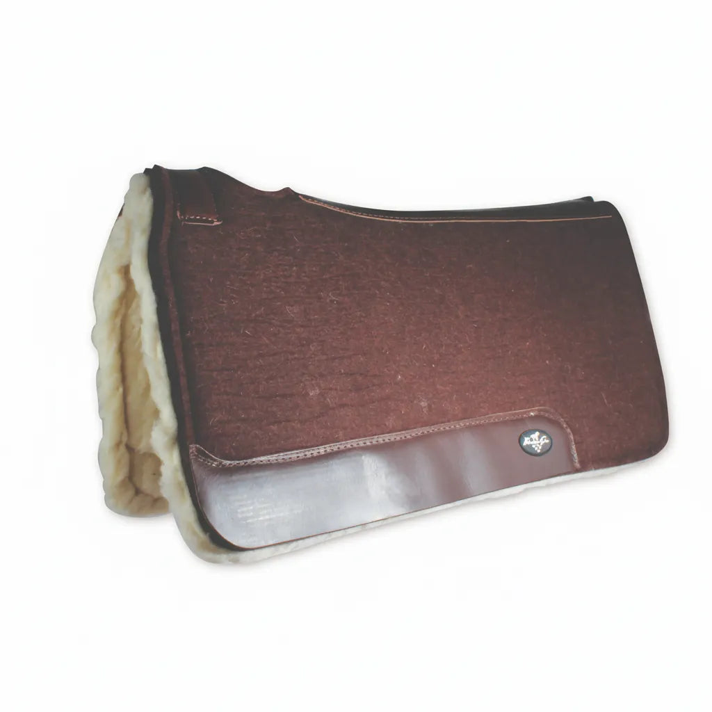 Professional’s Choice ComfortFit Wool with Fleece Saddle Pad in a rich brown. This contoured Western saddle pad features high-quality steam-pressed wool and a thick, plush fleece lining for ultimate horse comfort and impact protection. Designed with durable leather wear leathers and a contoured spine for a perfect fit under your Western saddle. Premium horse tack ideal for daily training, trail riding, or performance competitions.