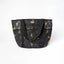 Mackey, Inc. Personal Tote Bag in heavy-duty black PVC mesh featuring a gold honeybee pattern with dotted flight paths. This durable equestrian shoulder bag includes an 8.5-inch handle drop, multiple exterior pockets for organization, and a spacious 19.25 x 12.75-inch design. Perfect as a stylish horse grooming tote, beach bag, or everyday carryall, this breathable mesh bag combines functional strength with a whimsical bee print.