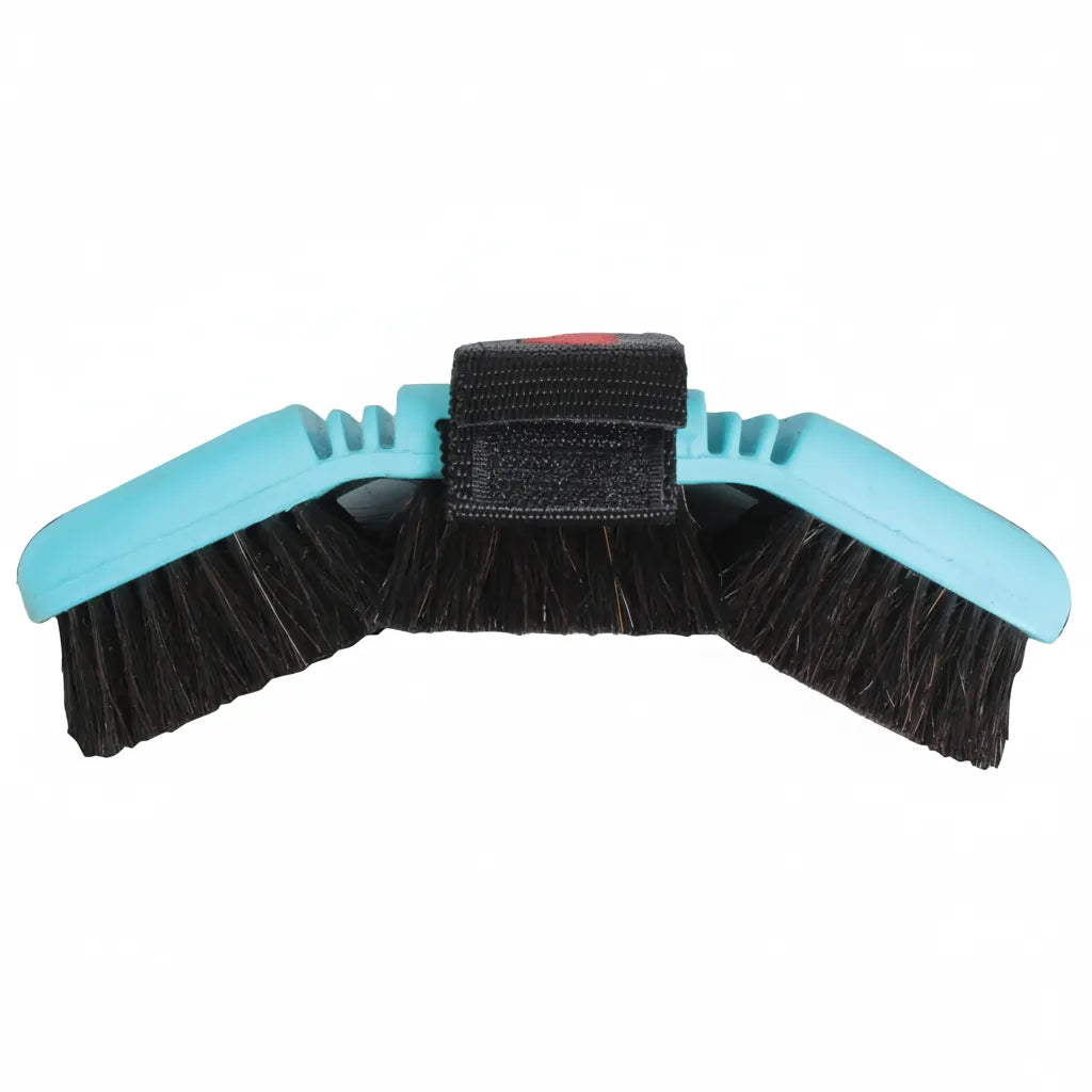 Professional's Choice Tail Tamer Soft Touch Flex Horse Hair Brush featuring a flexible light blue body and dark natural horse hair bristles. This ergonomic equestrian grooming tool includes a black adjustable hand strap and is designed to contour to your horse's body for a gentle, effective clean. High-quality flexible body brush perfect for horse care routines and maintaining a healthy, shiny coat.