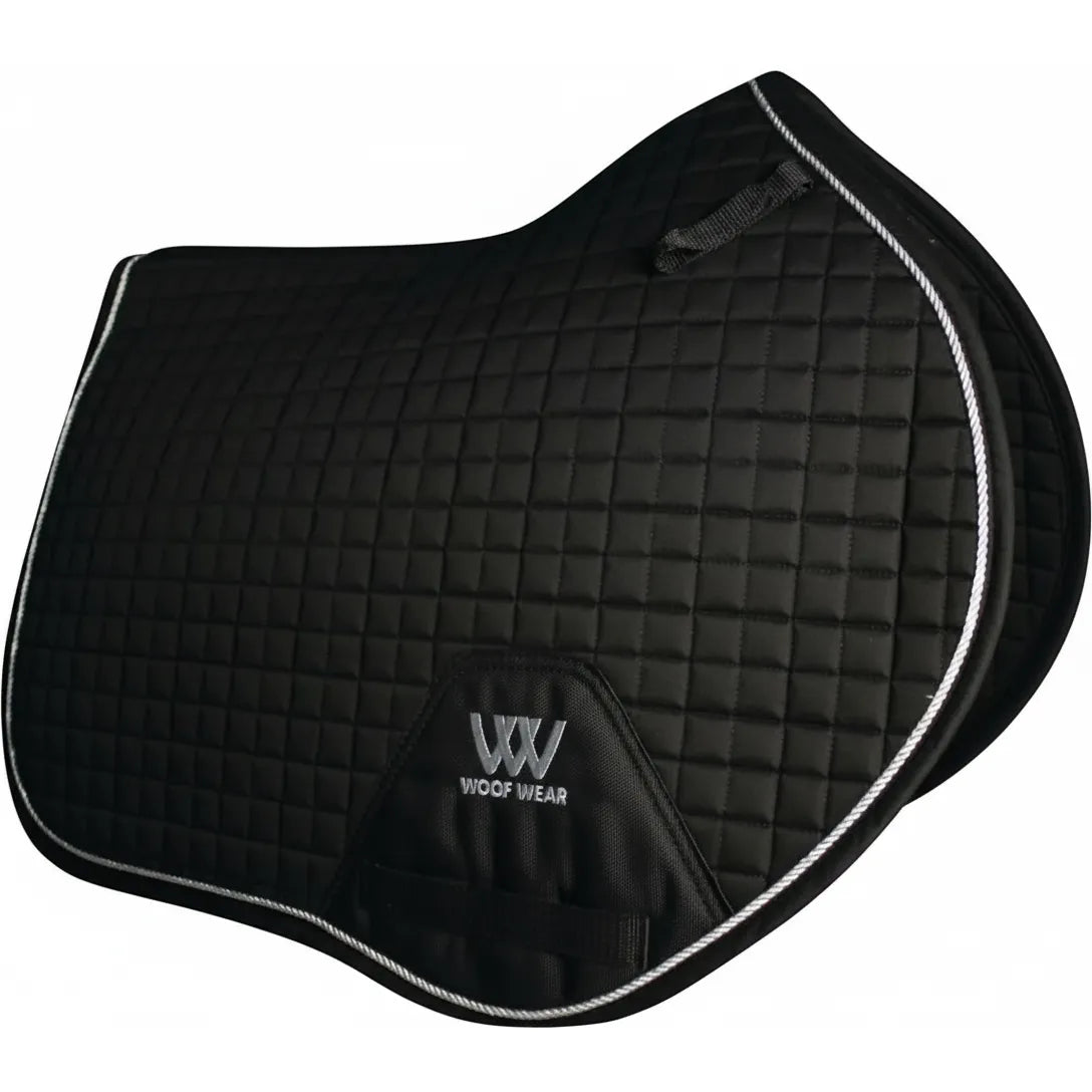 Black Toklat Woof Wear Close Contact English Saddle Pad with small square quilting and silver braided piping. Designed for equestrian performance, this full-size pad features a high wither profile, a 23-inch spine, and a reinforced girth patch with the Woof Wear logo. A stylish and functional choice for English riding and jumping.
