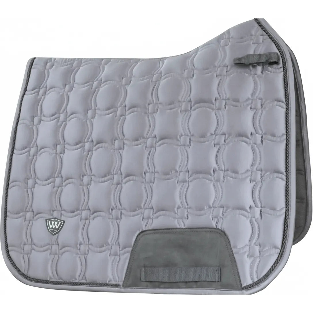 Toklat Vision Dressage Saddle Pad in a sophisticated steel grey satin finish. This full-size equestrian pad features a unique geometric quilted pattern, breathable mesh wicking liner, and reinforced girth protection area. Designed with a contoured spine and D-ring straps for a secure fit, it combines performance and luxury. Perfect for dressage training or shows, this pad adds a touch of elegance to any horse's tack set.
