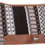 Patterned saddle pad with brown leather edges on a white background