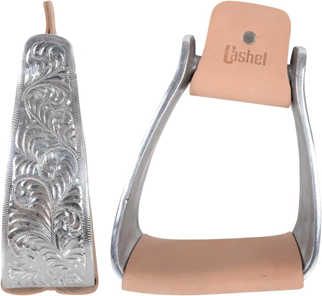 Pair of silver stirrups with intricate designs and tan leather straps on a white background, featuring the Cashel brand.