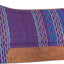 Purple and blue striped saddle pad with brown leather patch on a white background