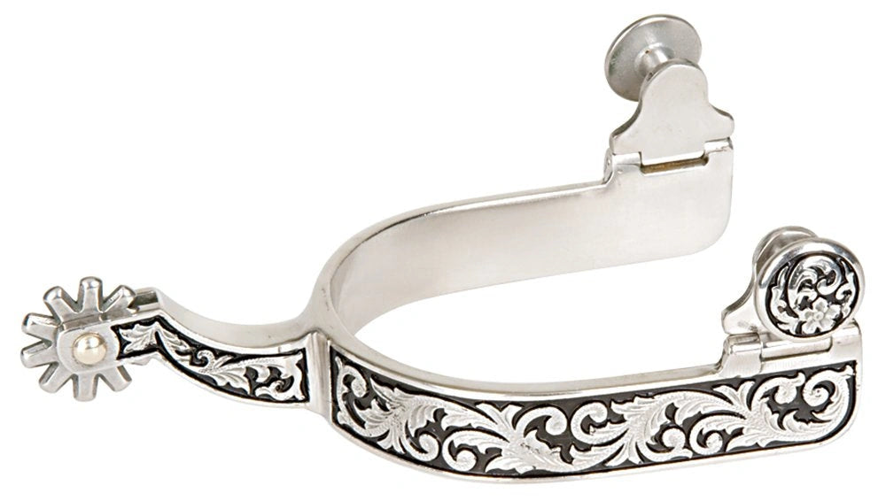 Decorative silver spur with intricate designs on a white background