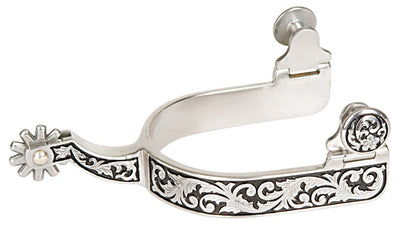 Decorative silver spur with intricate designs on a white background