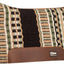 Patterned horse saddle pad with brown leather flap on a white background