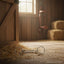 Myler MB 09 Loose Ring Snaffle Bit in stainless steel and copper, lying on a straw-covered barn floor. A red leather bridle hangs on the wall, and hay bales are visible in the sunny background.