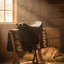 Cashel G2 Soft Saddle on a patterned saddle pad in a sunlit barn with a sleeping golden retriever dog on hay.