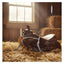 Myler MB 04 Snaffle Bit with sweet iron and copper inlay for comfort, resting on a western saddle amidst hay in a sunlit barn.