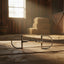 Myler MB 06 Dee Snaffle horse bit with a medium port mouthpiece, made of stainless steel, resting on a wooden barn floor with sunlight streaming in.