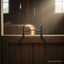 Myler MB 06 Sweet Iron Mullen Barrel curb bit with copper inlay, hanging on a rustic stable door in a sunlit barn.