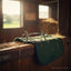 Myler MB 04 Pelham bit on a green quilted pad in a sunlit stable with hay, for English riding comfort and control.