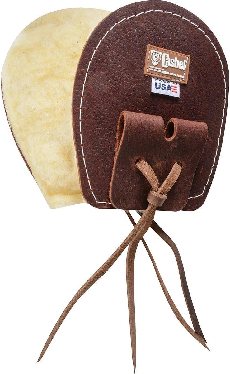Brown leather boot jack with a white label on a white background