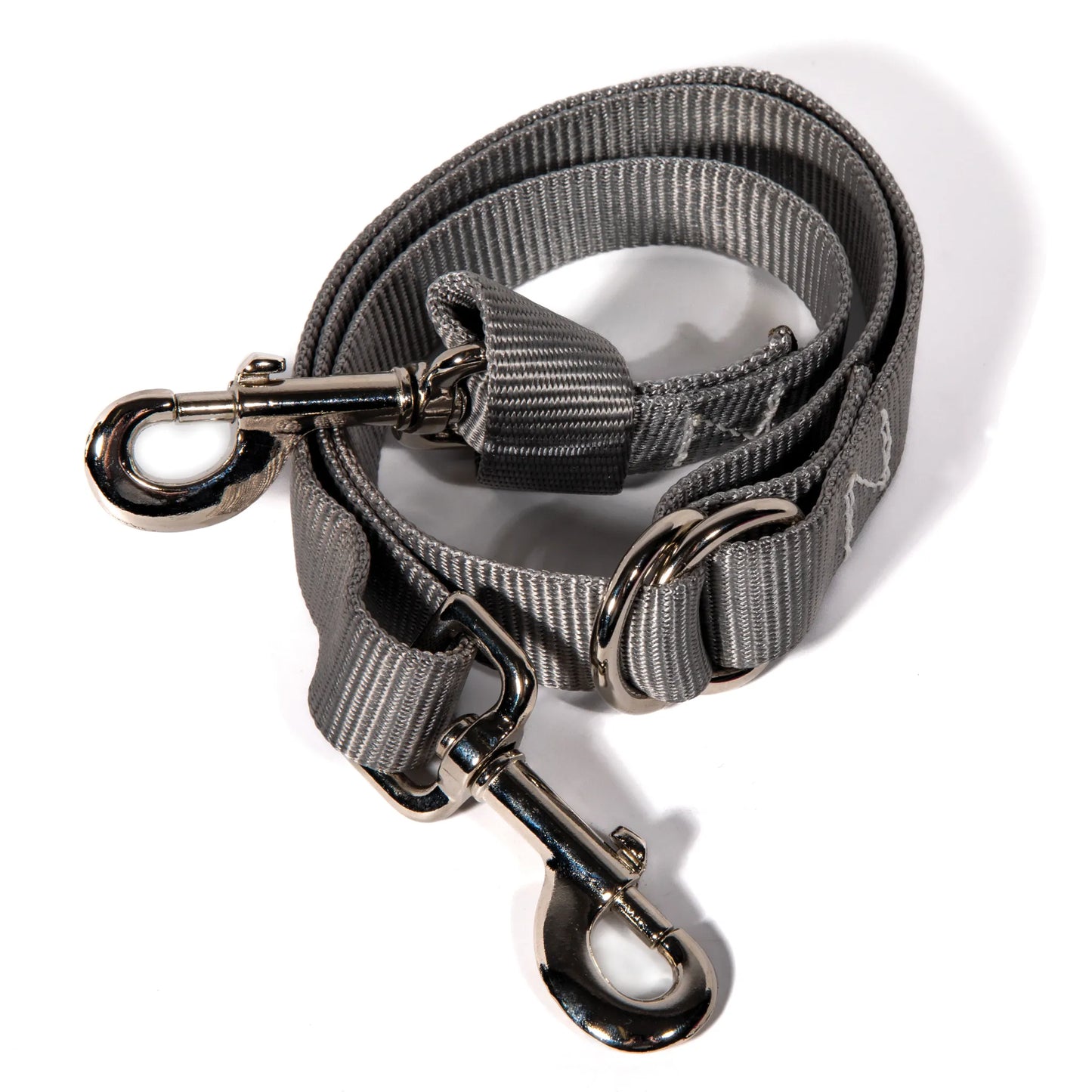 Professional's Choice 1in Nylon Tie Down Strap #8057 in grey. This durable equestrian accessory features high-quality 1-inch wide nylon webbing with heavy-duty nickel-plated swivel snap hooks for secure horse tack attachment. Designed for western training and riding, the adjustable slide allows for a precise fit. Essential horse equipment for trainers and riders looking for reliable, long-lasting performance in the arena or on the trail.