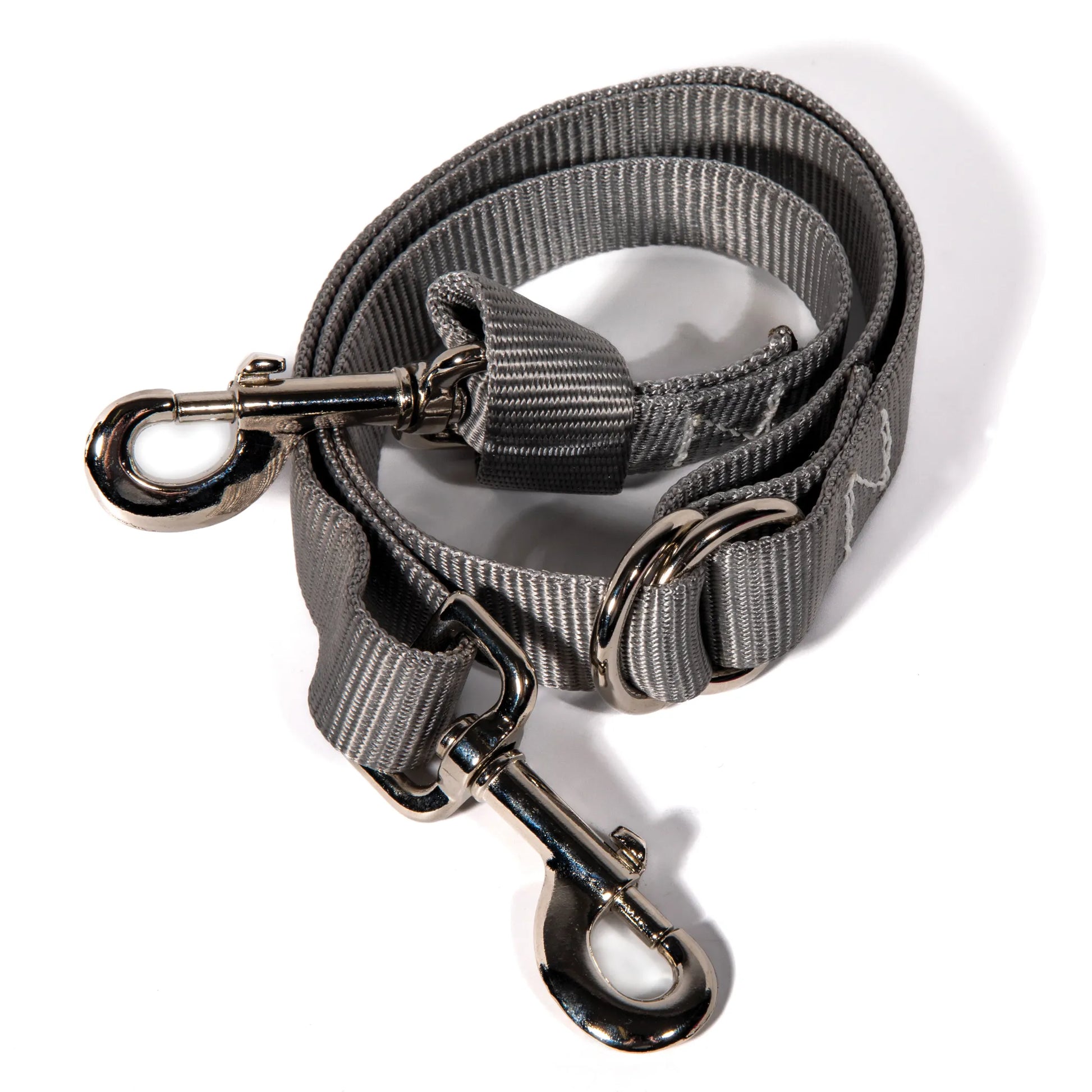 Professional's Choice 1in Nylon Tie Down Strap #8057 in grey. This durable equestrian accessory features high-quality 1-inch wide nylon webbing with heavy-duty nickel-plated swivel snap hooks for secure horse tack attachment. Designed for western training and riding, the adjustable slide allows for a precise fit. Essential horse equipment for trainers and riders looking for reliable, long-lasting performance in the arena or on the trail.