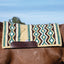 Professional's Choice Comfort-Fit SMX Air Ride Saddle Pad featuring a stylish Southwest geometric pattern in teal, brown, and cream. This high-quality wool western saddle pad is shown on a chestnut horse, highlighting its contoured fit and durable leather wear leathers. Perfect for trail or performance riding, it offers superior shock absorption and breathability. Available in 33"x38" or 30"x34" sizes, including the OrthoSport option for maximum equine comfort.