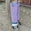 Professional's Choice Deluxe Fly Boots in purple on a horse's hind legs. These high-quality equestrian fly boots feature breathable lavender mesh and grey trim, offering ultimate protection from flies, UV rays, and debris. The stay-up design ensures a secure, contoured fit for turnout or stall use. Durable and stylish, these mesh boots are essential for summer horse care and equine leg protection.