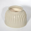 Professional's Choice natural cream rubber bell boot for horse hoof protection. Features a durable, heavy-duty ribbed design to prevent overreaching injuries and impact damage. This essential equestrian gear offers a secure fit and shock absorption for turnout or riding, ensuring long-lasting performance and safety for your horse's hooves.