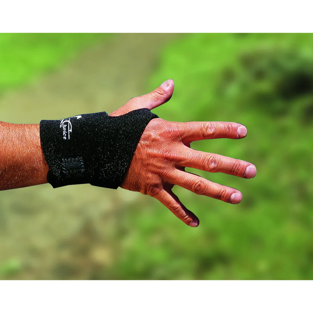 Professionals Choice Simple Wrist Wrap in black, featuring a low-profile design with a thumb loop for secure compression and wrist support. This athletic wrist brace provides stability for sports, weightlifting, and everyday joint relief. Lightweight and adjustable, it showcases the Professional's Choice logo on a durable, breathable wrap designed to enhance performance and reduce strain.